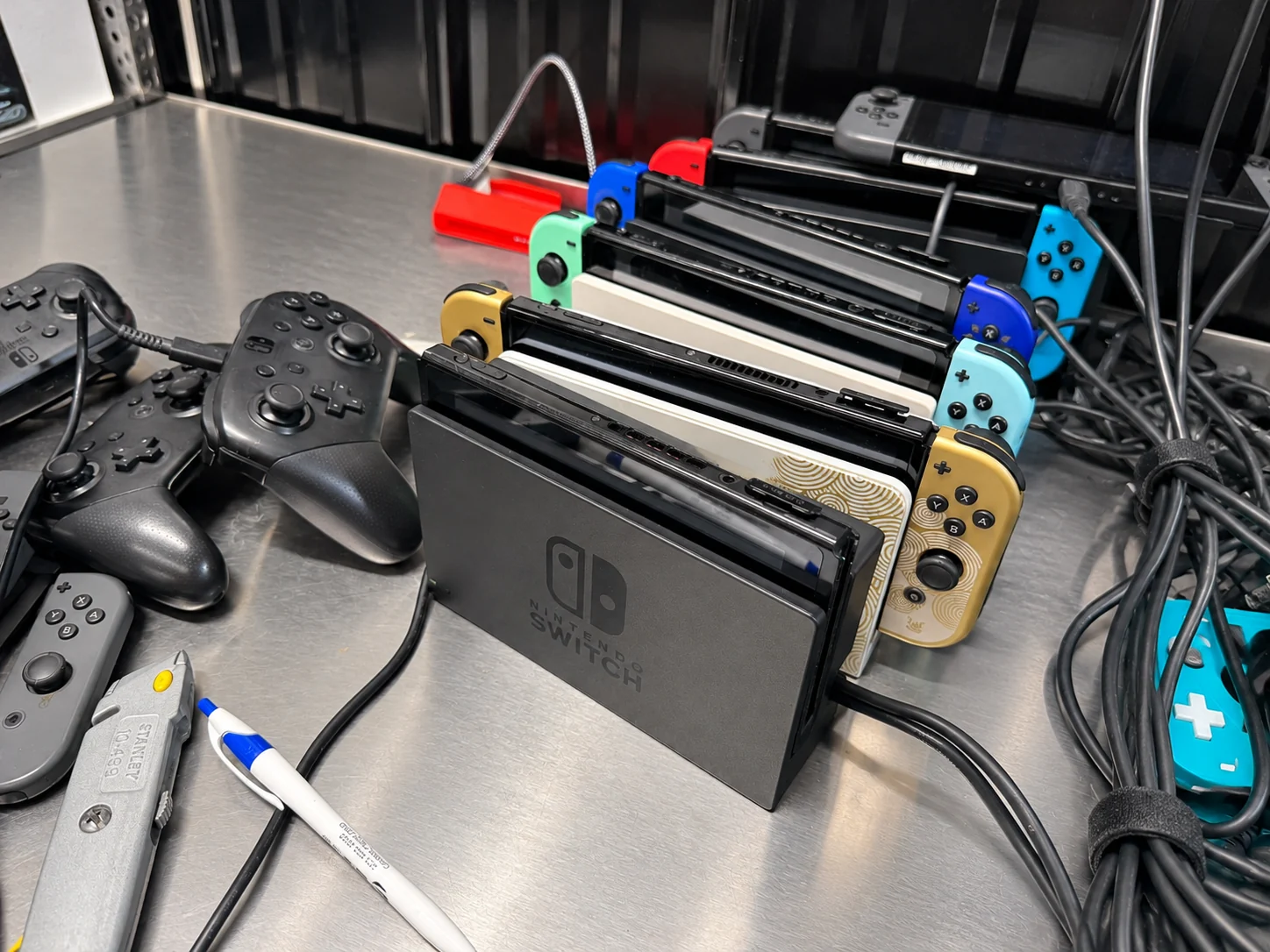 Nintendo Switch consoles lined up on our testing bench.